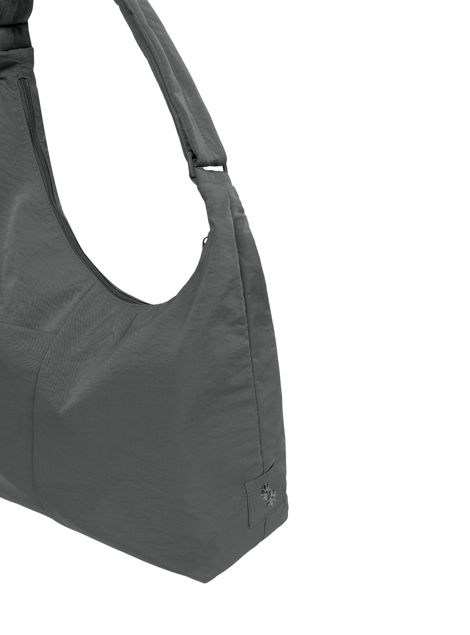 Close-up of the Midi Arc hobo-style bag in dark grey nylon, showing metal logo emblem