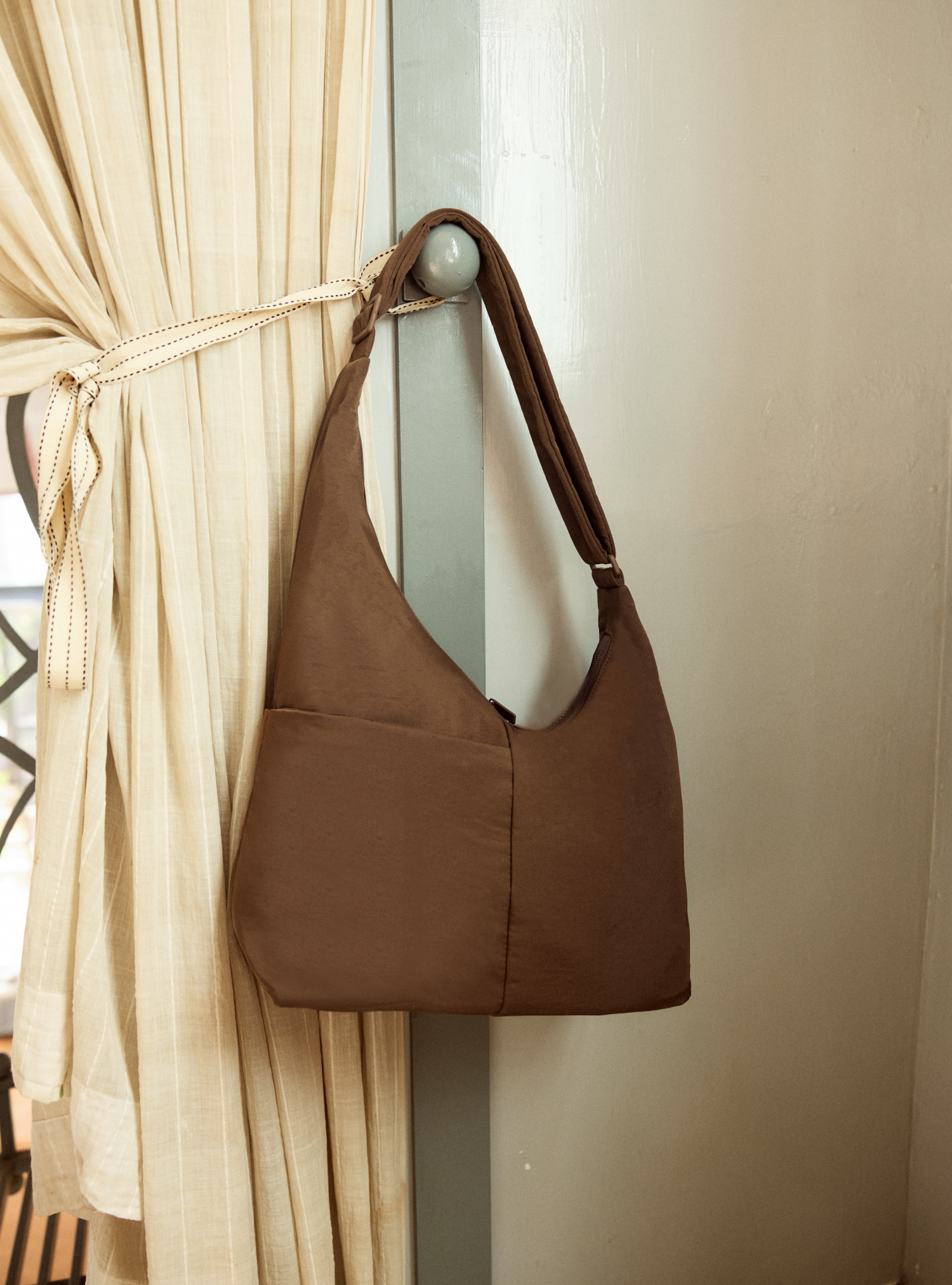 The Midi Arc slouchy hobo bag in chocolate brown nylon for work, travel and everyday use